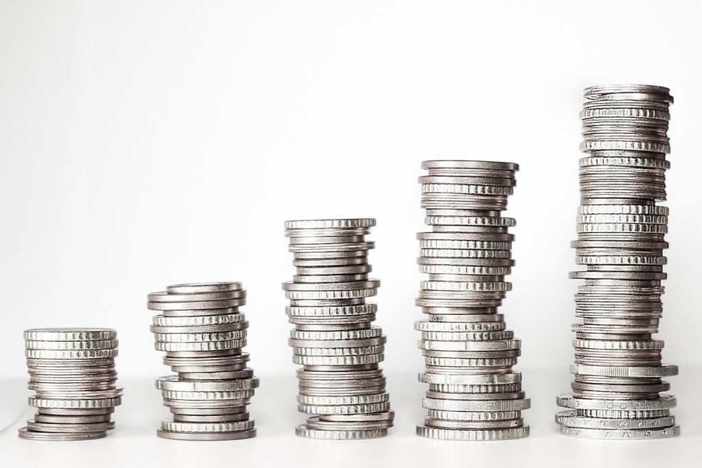 Stacks of coins, illustrating the concept of nurturing financial growth and smart money habits.